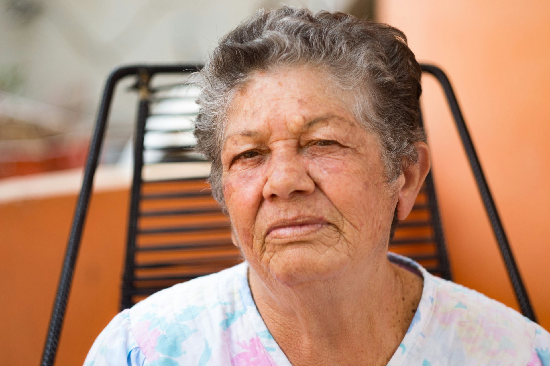 older woman staring at camera